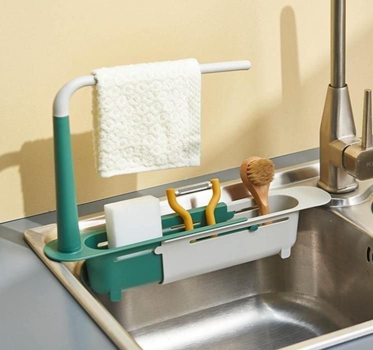 Adjustable over-sink rack with compartments for dishwashing accessories and a cloth holder